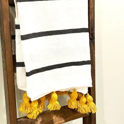 Striped Throw with Yellow Pom Poms